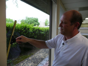 man cleaning window