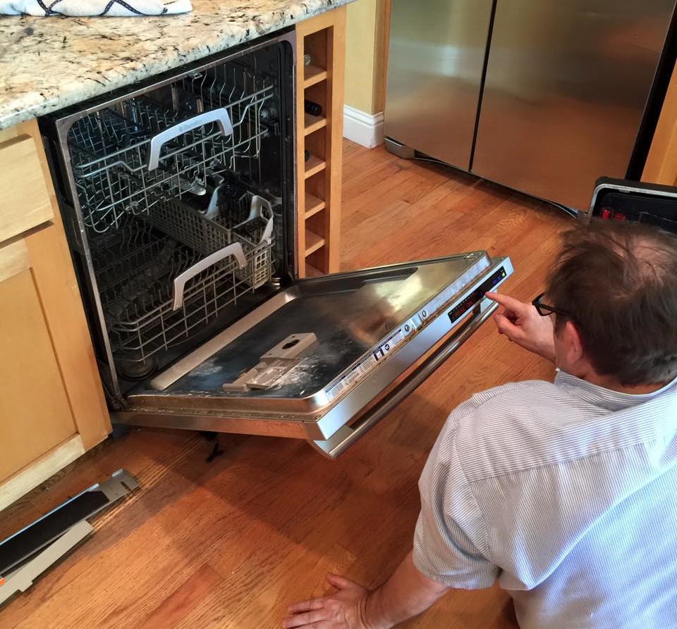 dishwasher being repaired