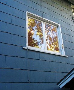 blue painted home exterior with window