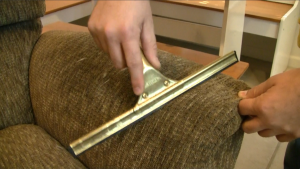 remove pet hair with rubber squeegee